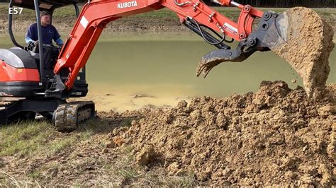 digging a pond with a mini excavator|digging a small farm pond.